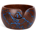 Rosewood yarn bowl with resin accents and a curved yarn guide